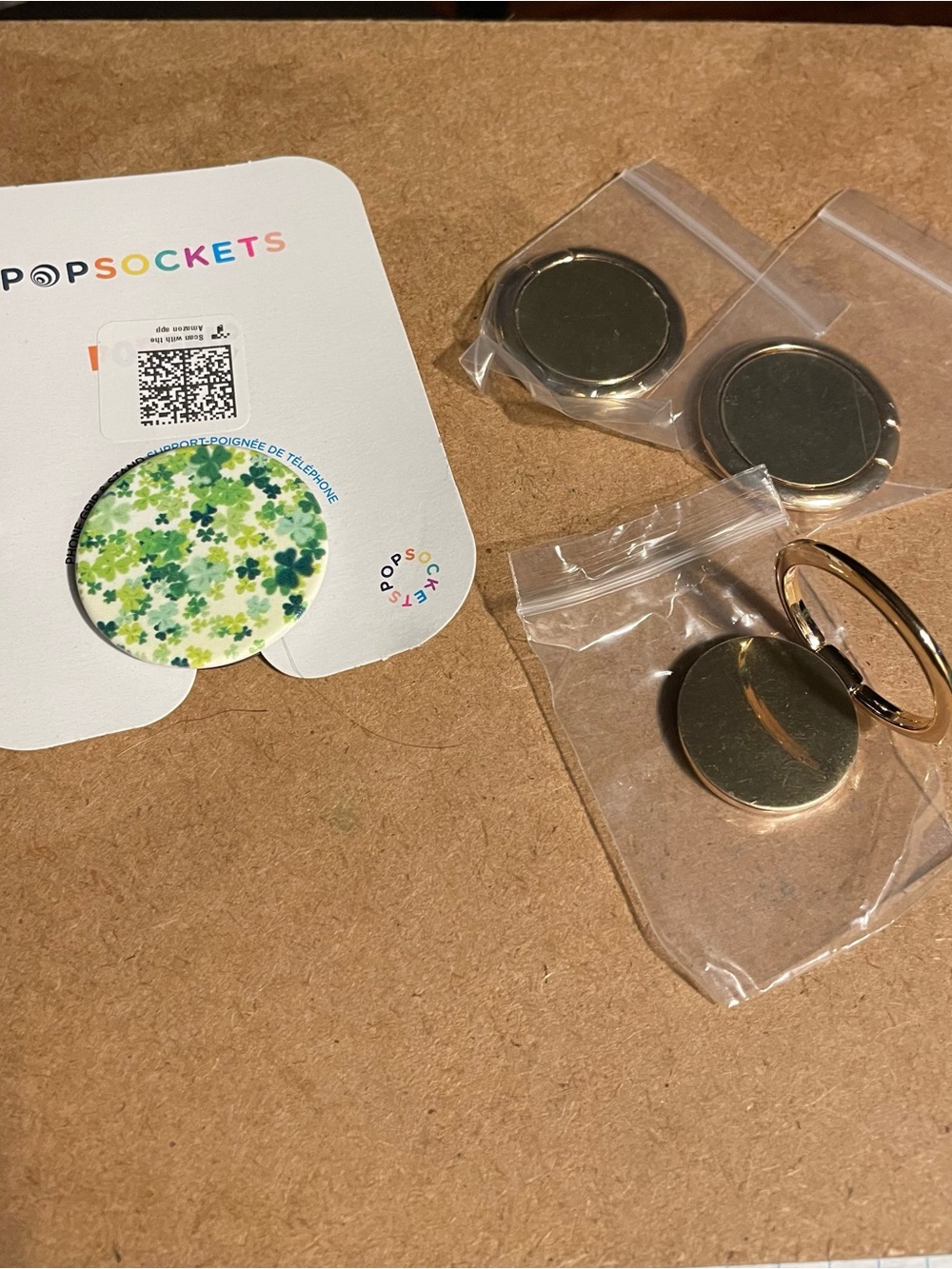 PopSocket shamrocks design PopGrip and three Gold Ring phone grips.